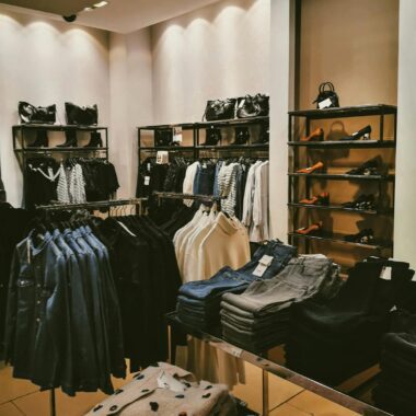 Stylish clothing store interior featuring a modern display of apparel and accessories.